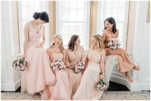 bridesmaids in blush pink gowns