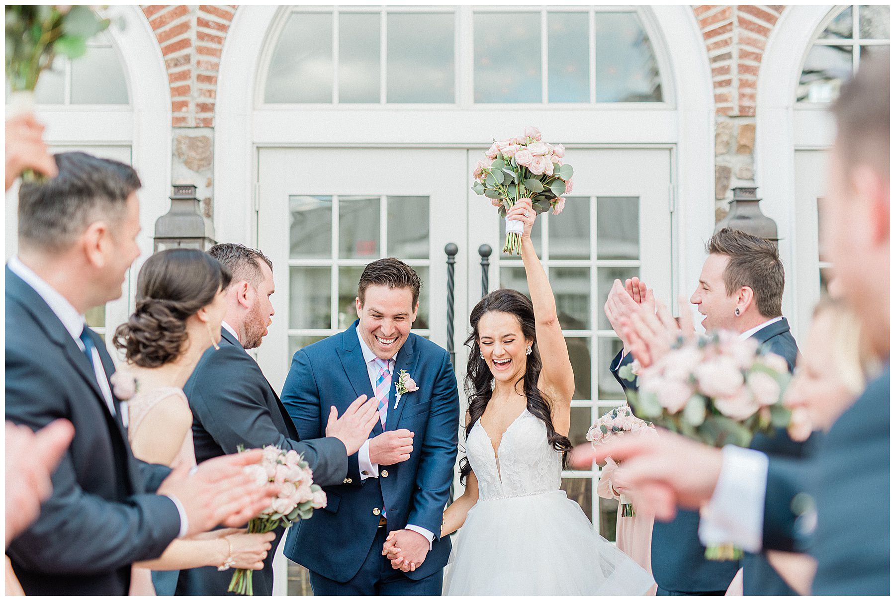 wedding party cheers for bride and groom before Ryland inn wedding