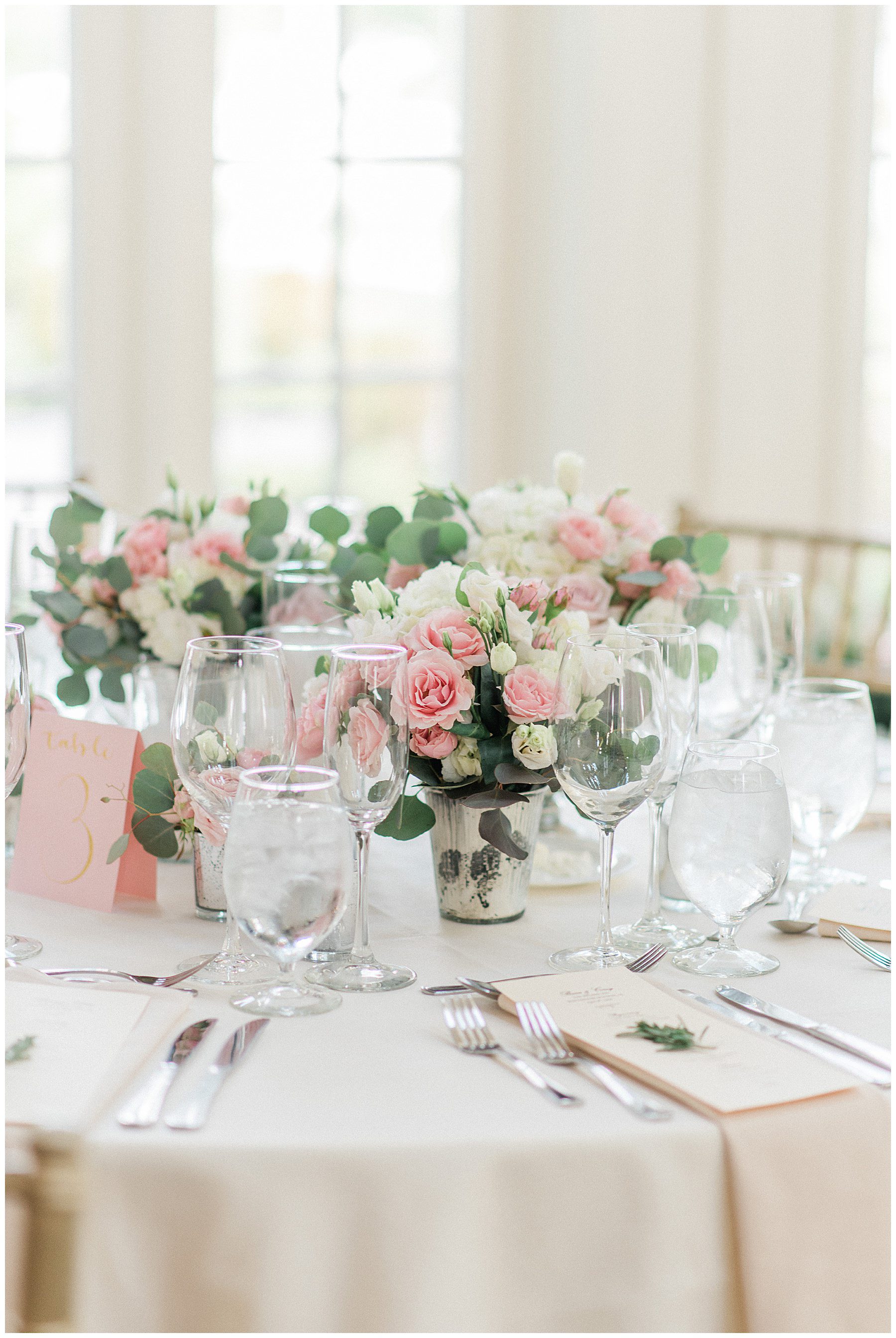 low flower arrangements in center of reception tables