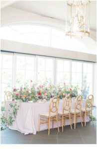 vibrant and colorful flowers decorate table at reception