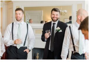 groomsmen toast with groom before wedding ceremony at Cairnwood Estate