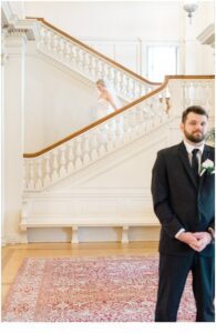 bride coming down the stairs for first look before Late Summer Wedding at Cairnwood Estate