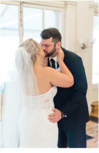 couple kiss during first look