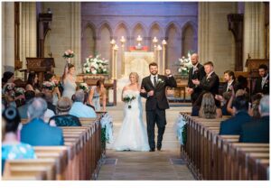 newlyweds exit church after Late Summer Wedding at Cairnwood Estate