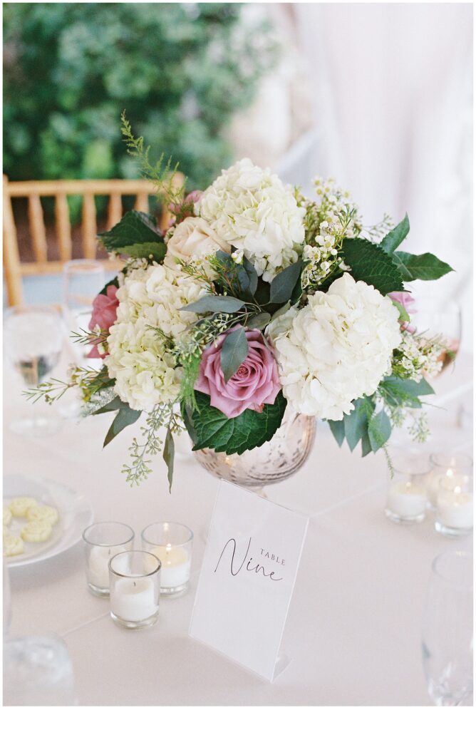 summer wedding flowers decorate reception tables