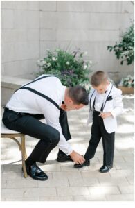 groom helping his son get ready