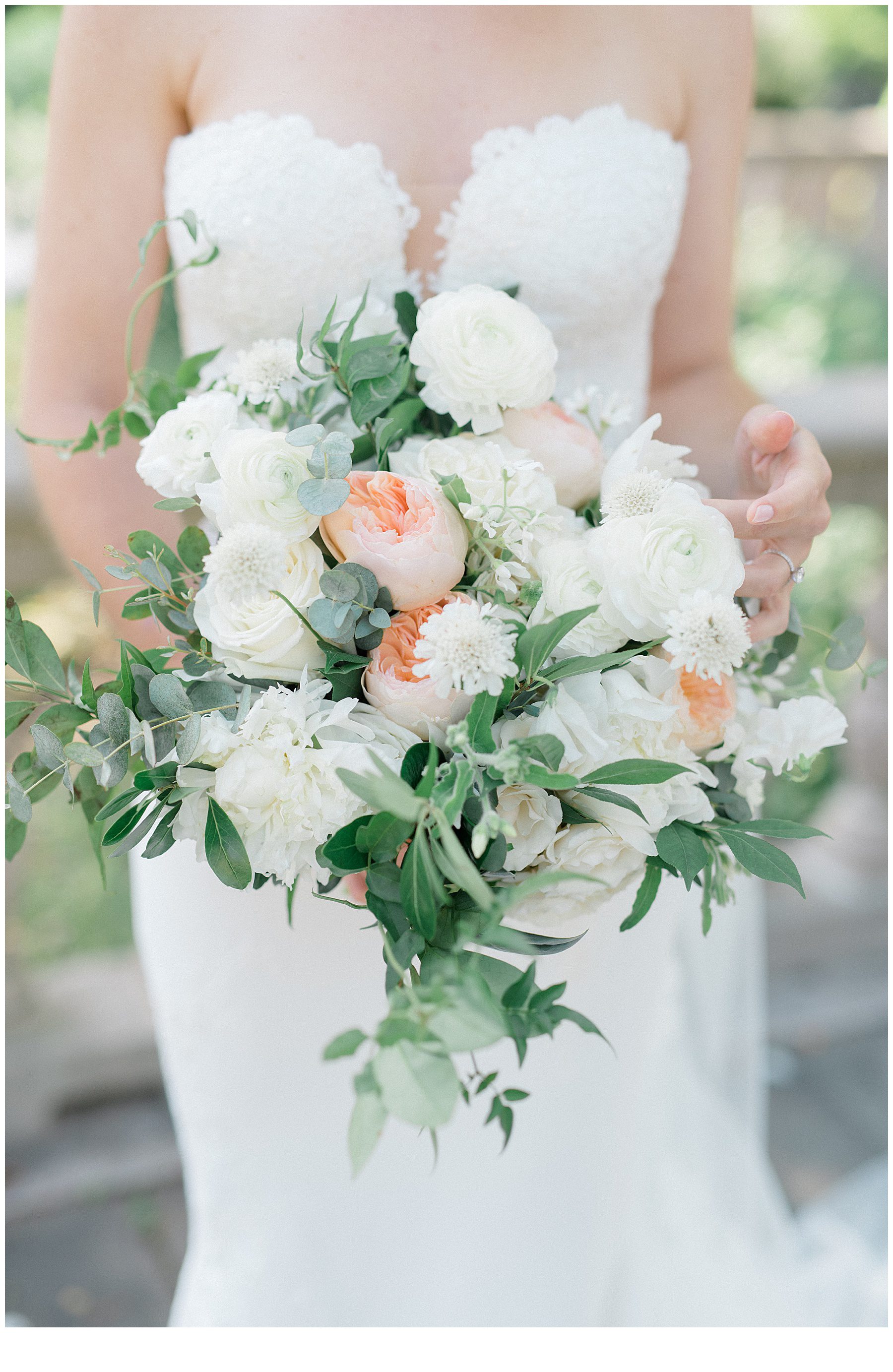 White and peach flowers in bridal bouquet