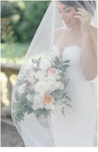 bridal portraits holding elegant wedding bouquet