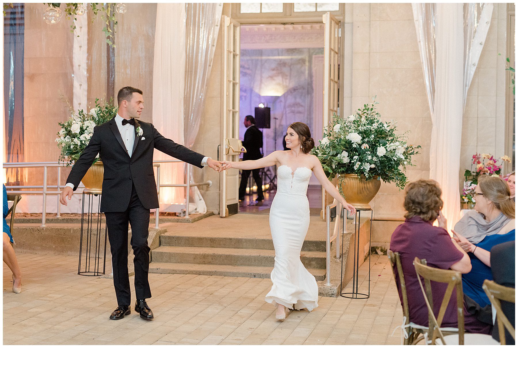newlyweds enter wedding reception at Curtis Arboretum