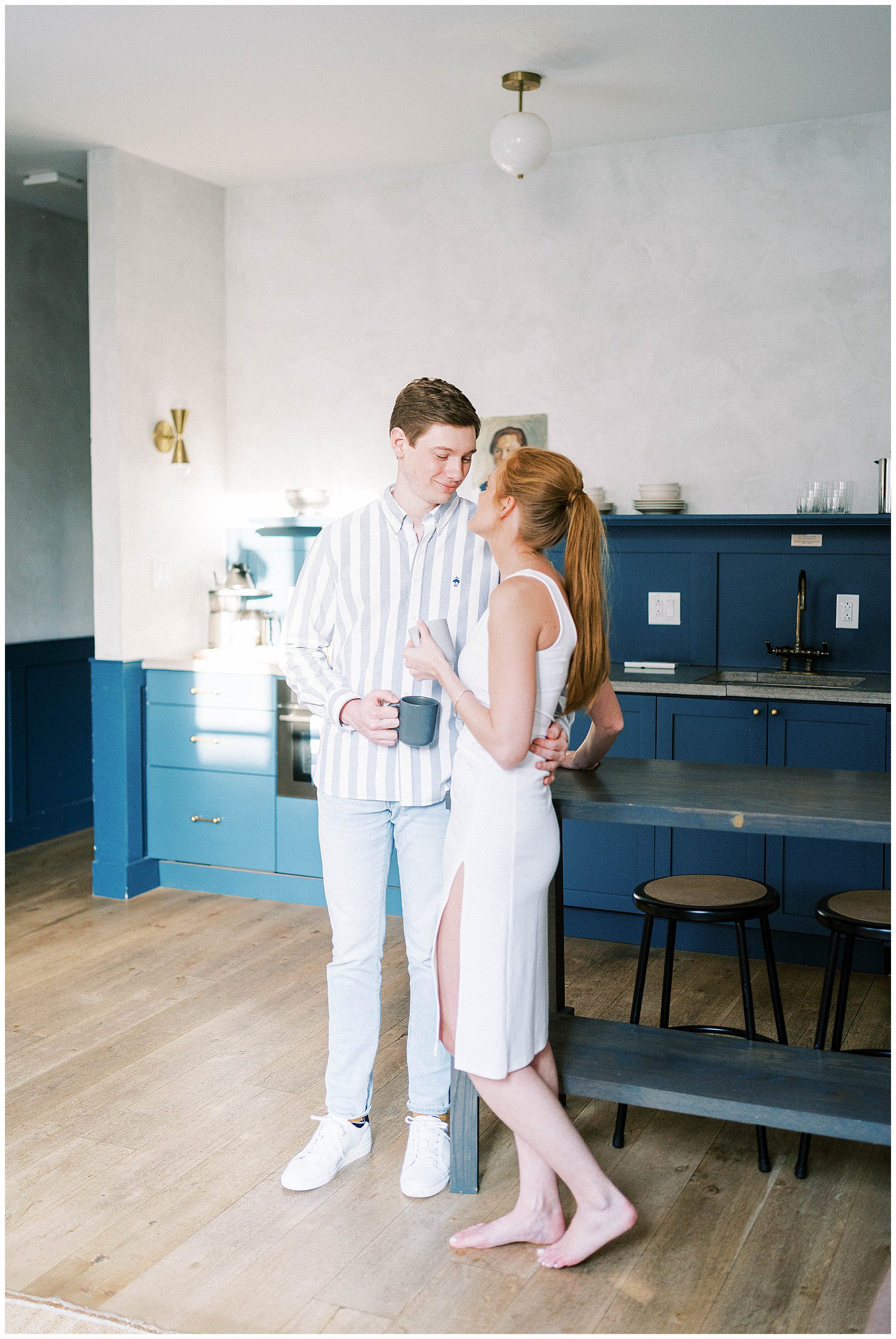 couple share a cup of coffee during intimate engagement session in Old City Philadelphia at Lokal Hotel
