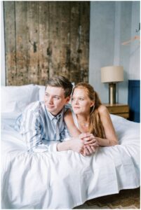 engaged couple snuggle together at Lokal Hotel in Old City Philadelphia