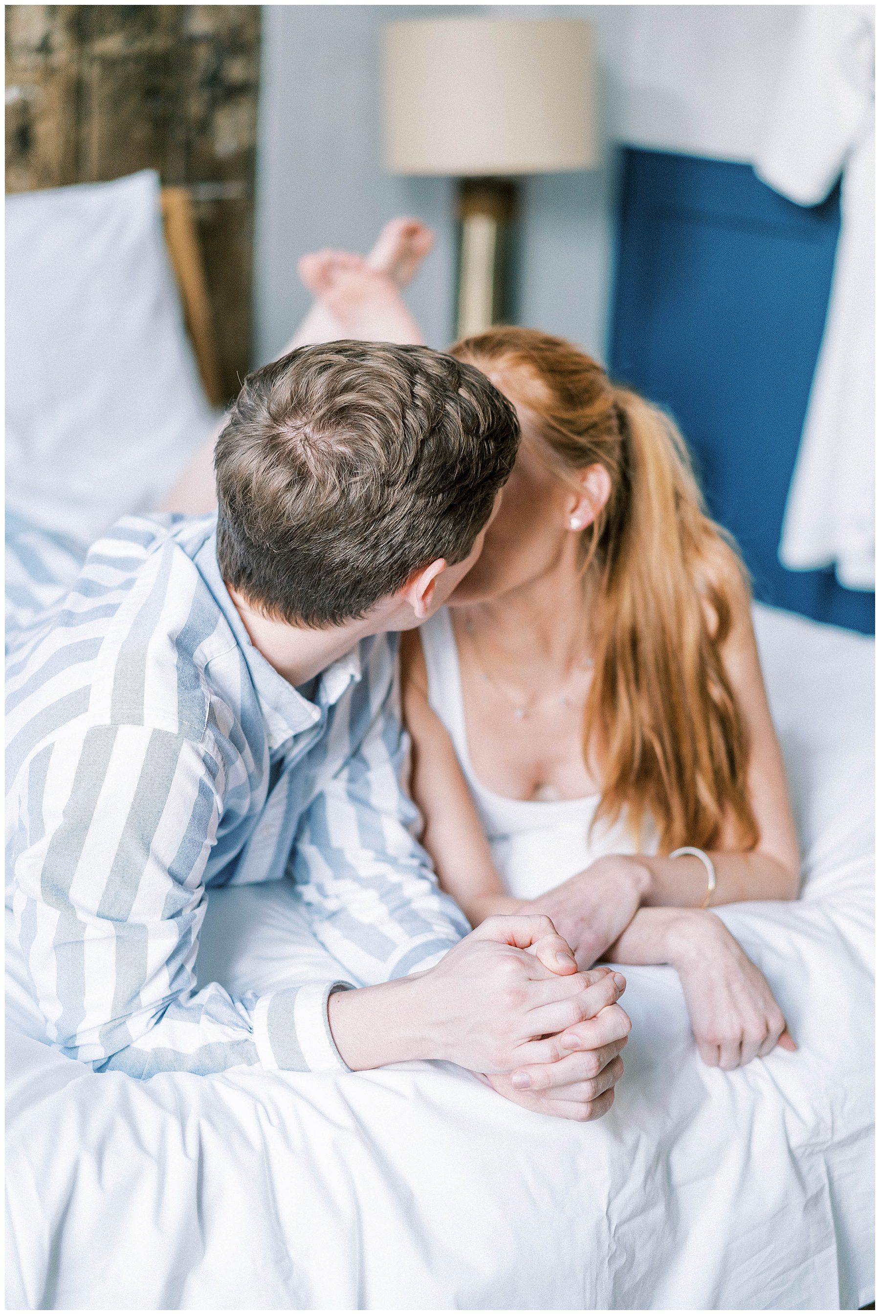 couple kiss during intimate engagement session at Lokal Hotel in Old City Philadelphia
