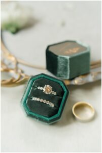 wedding rings in dark green ring box
