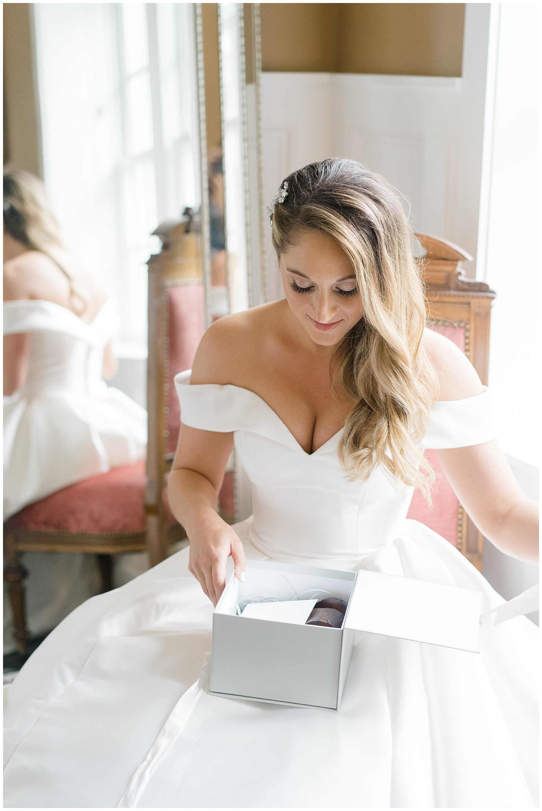 bride opens gift from groom