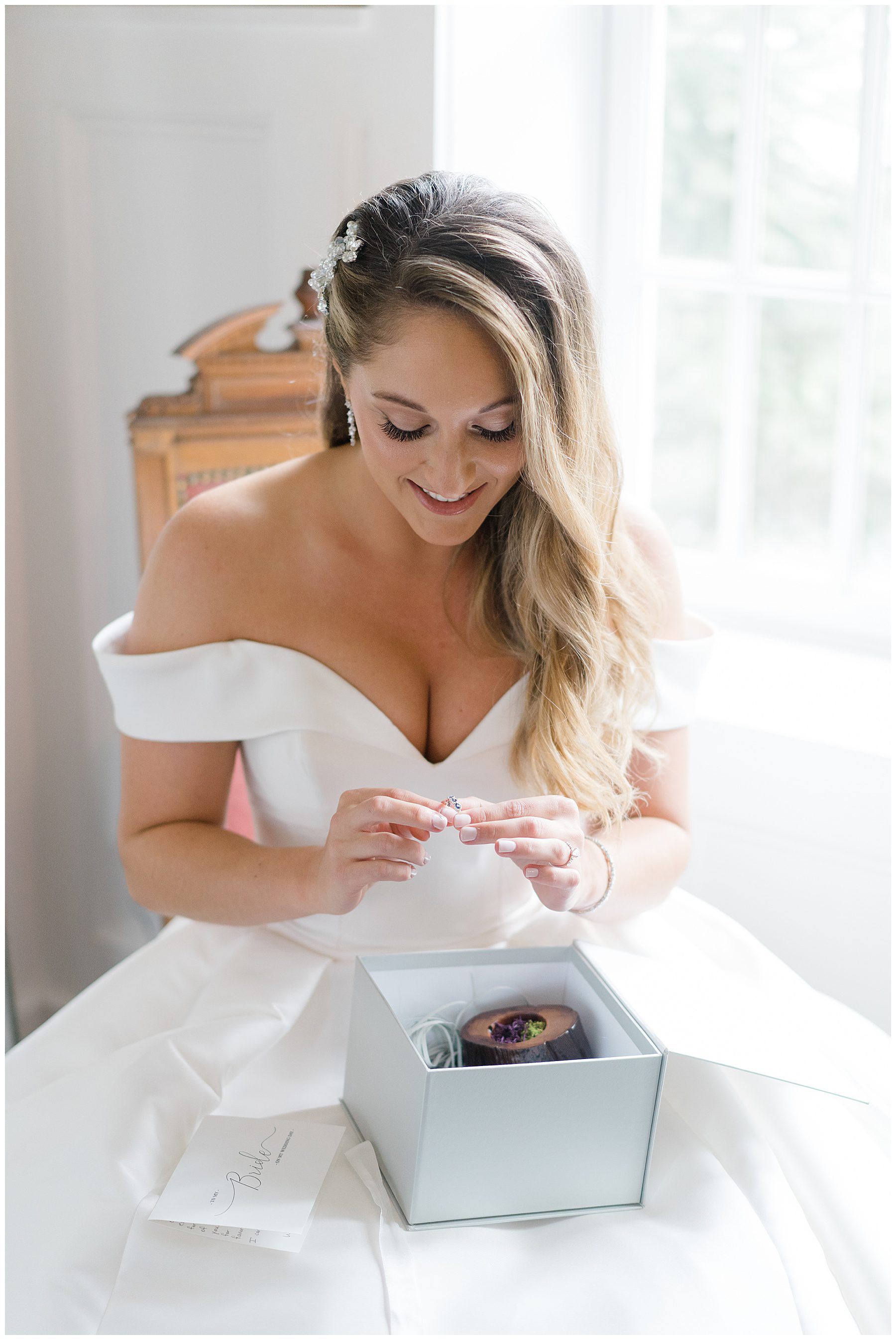 bride opens gift before wedding ceremony