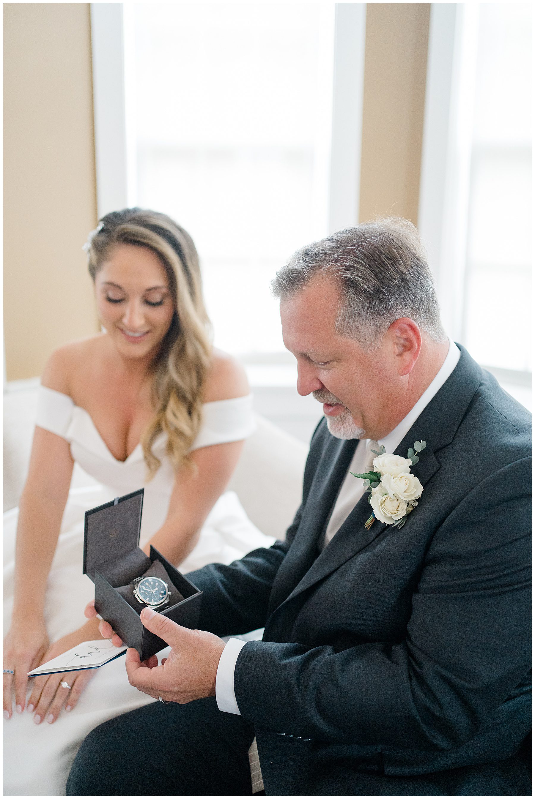 bride gives her father a gift before Ryland Inn Coach House Wedding