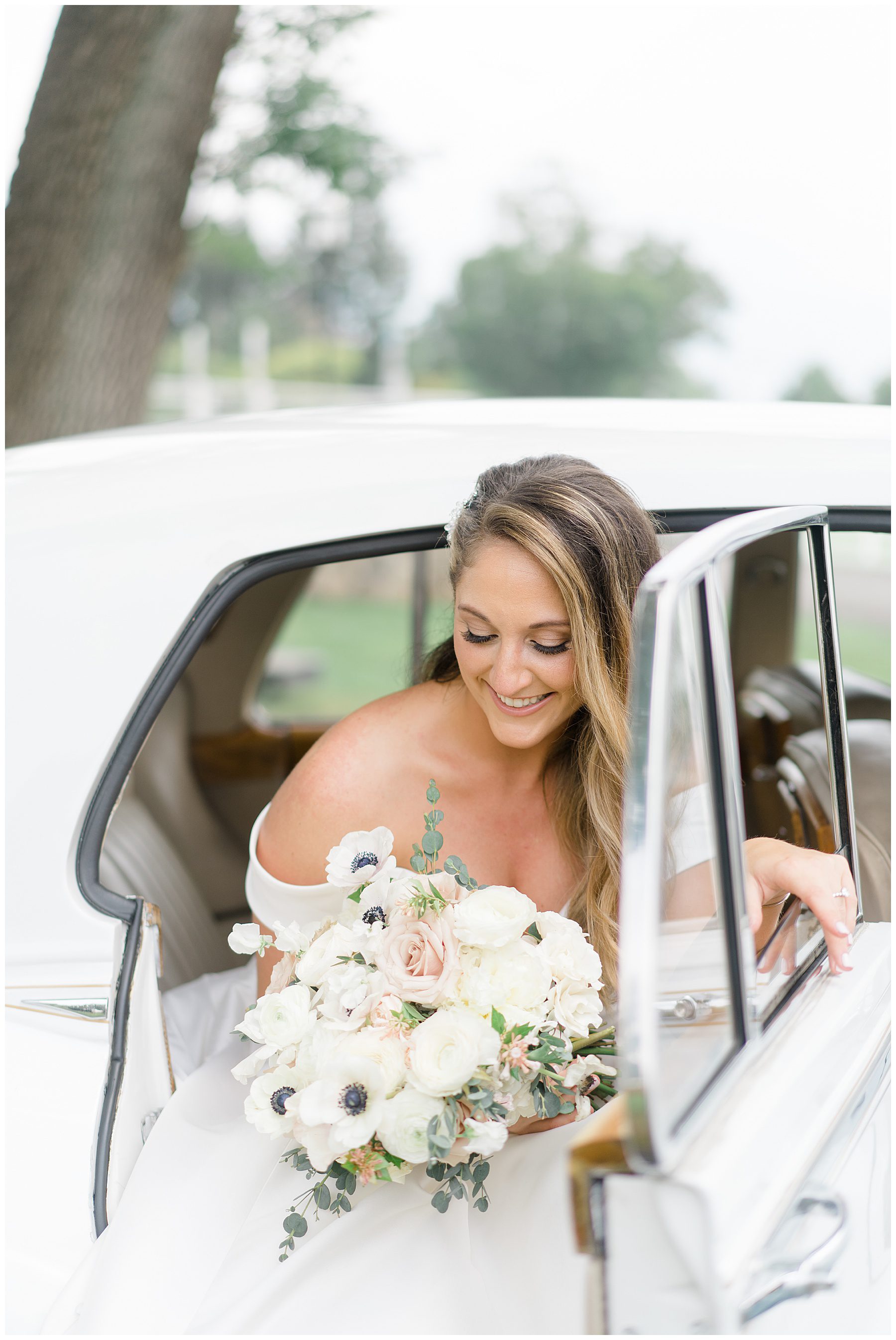 bride gets out of classic car