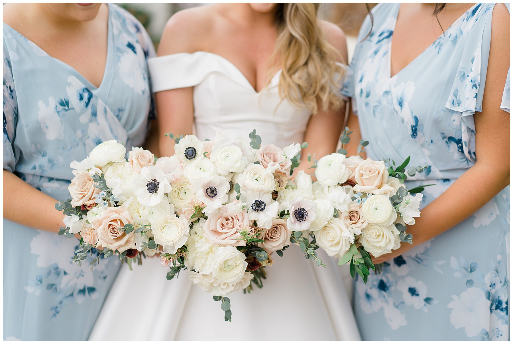 bride and bridesmaids hold elegant wedding flower bouquet