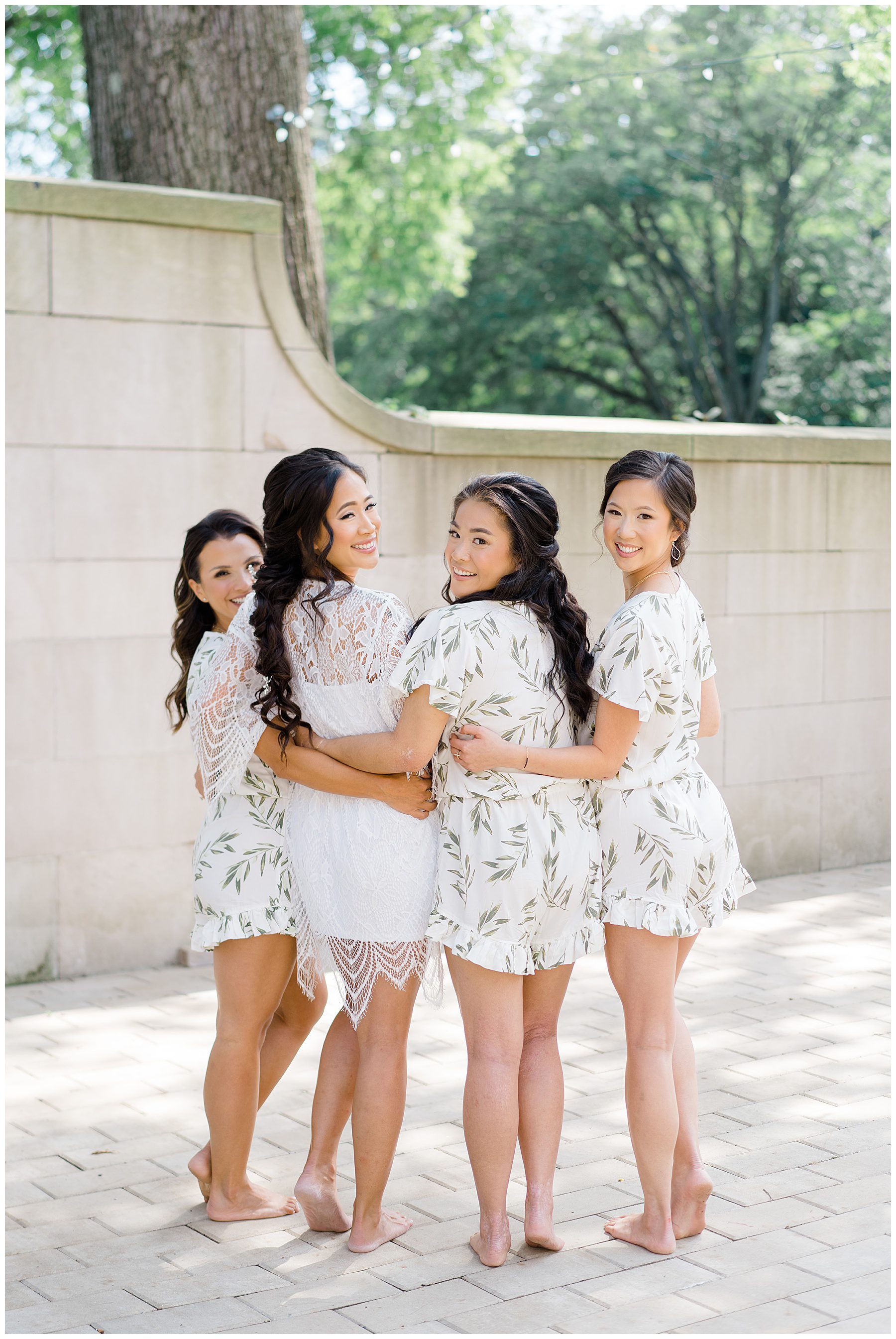 bride with bridesmaids in matching outfits