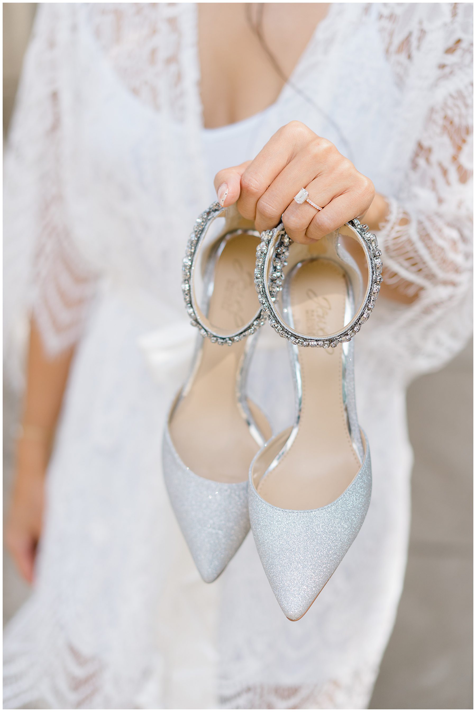 bide holds up wedding shoes