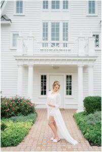 bride in front of Luxurious Ryland Inn