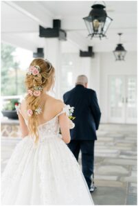 moment before first look between bride and dad