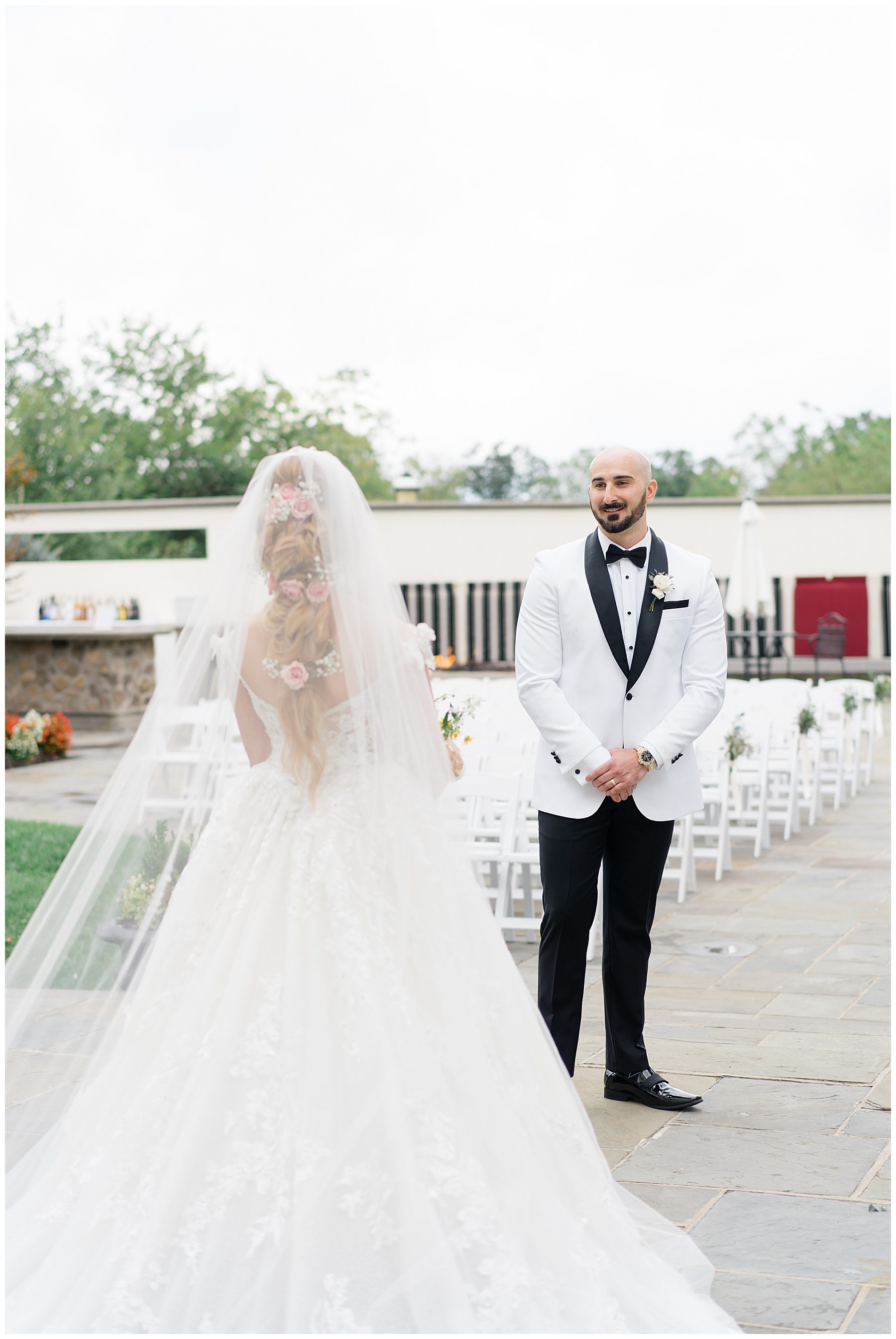 groom sees bride for the first time before Luxurious Ryland Inn Grand Ballroom Wedding
