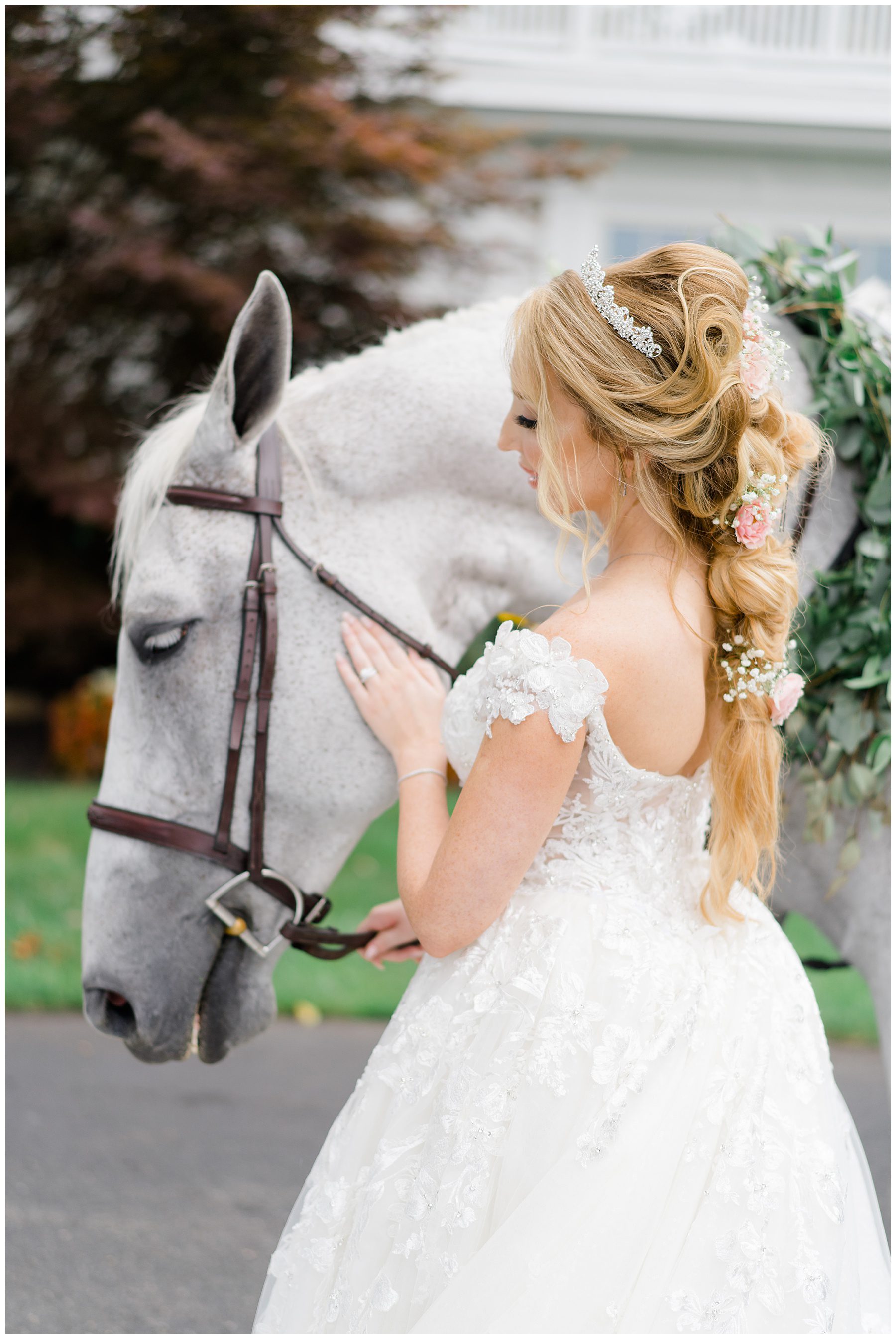 bride with white horse before fairytale wedding at Luxurious Ryland Inn Grand Ballroom