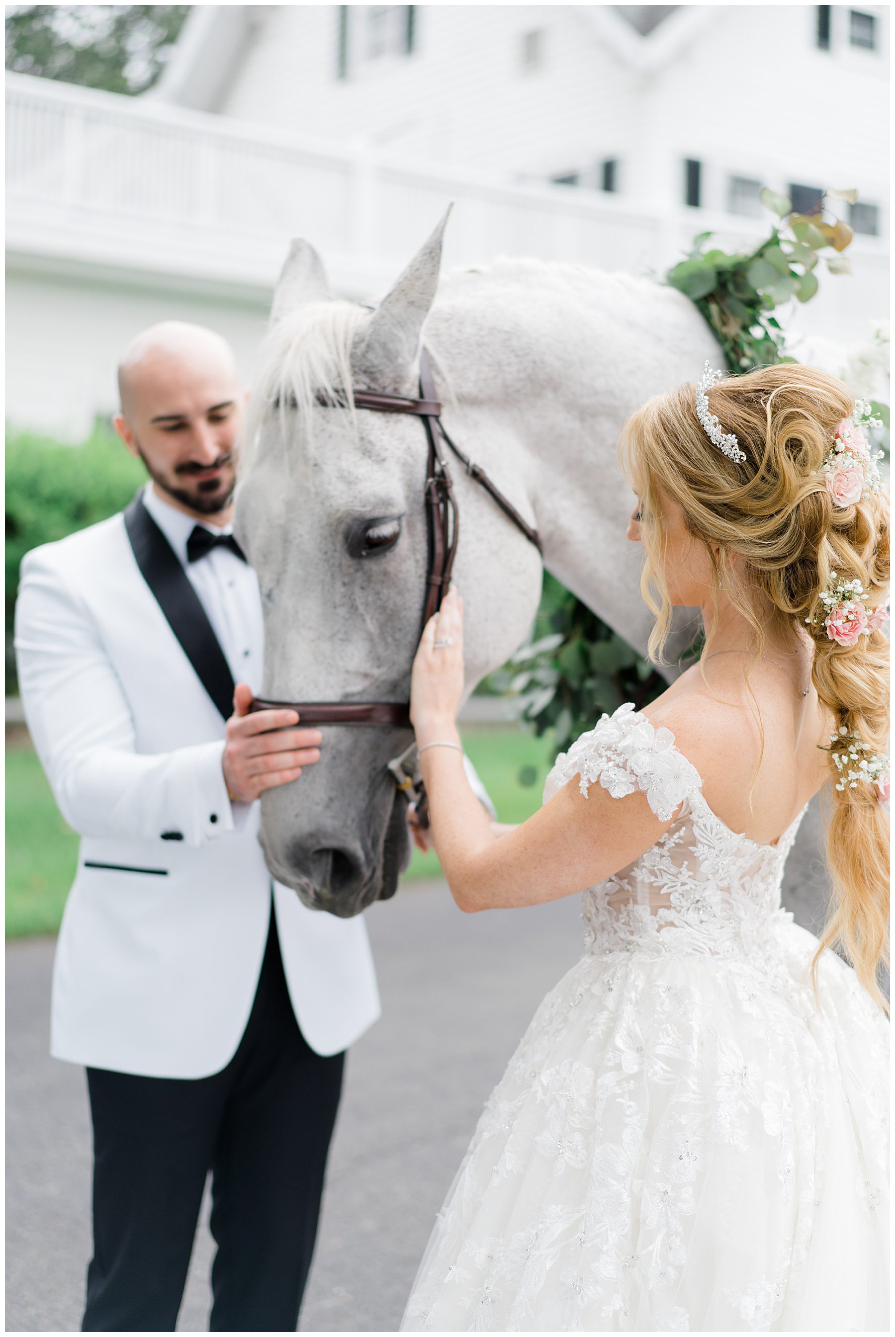 bride and groom with horse before their fairytale wedding