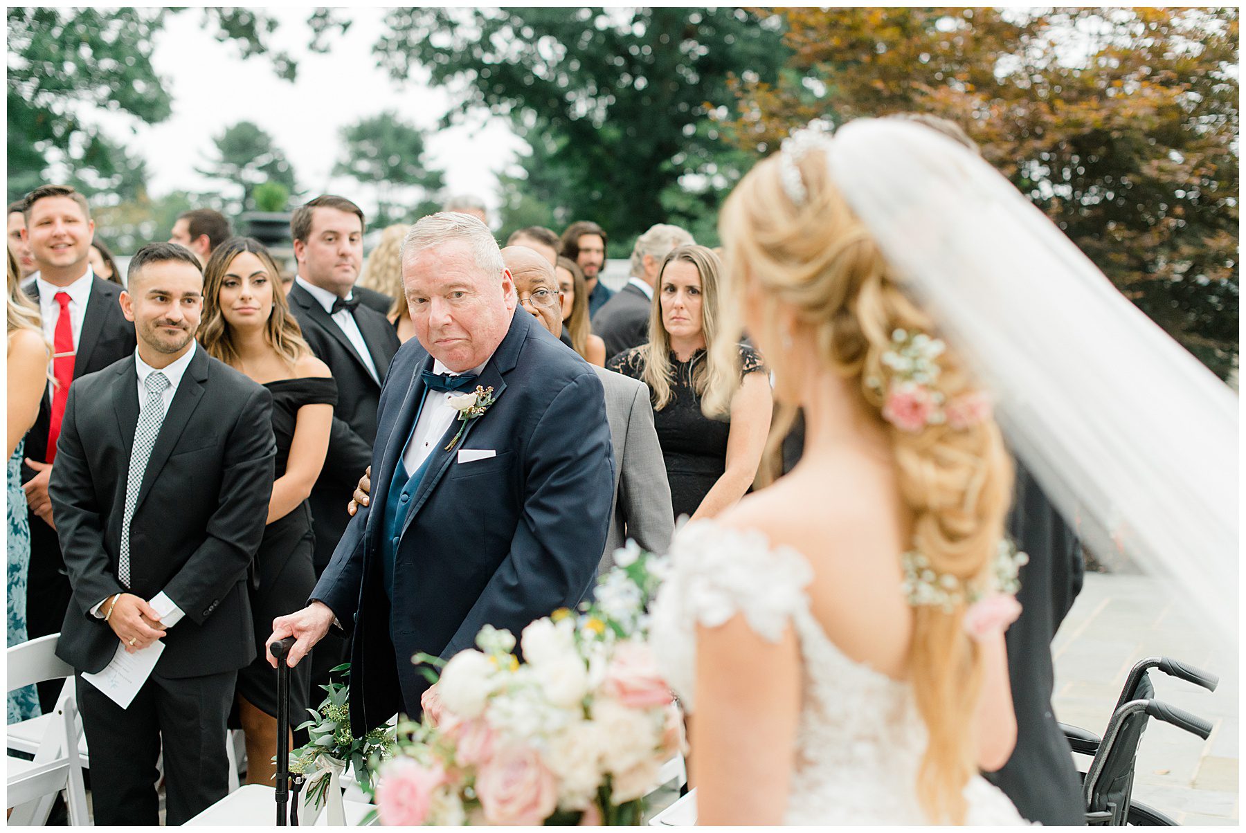 bride comes down the aisle with her father