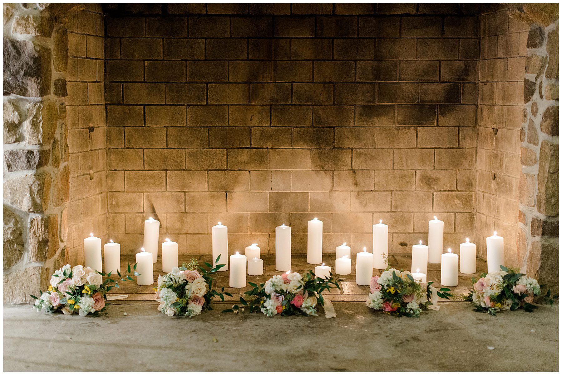 candles in stone fireplace at reception