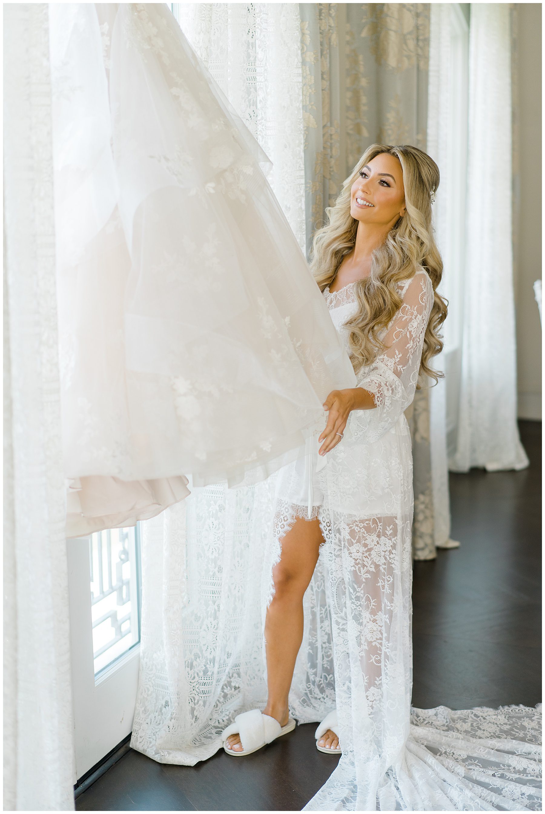 Bride looking at dress in bridal suite