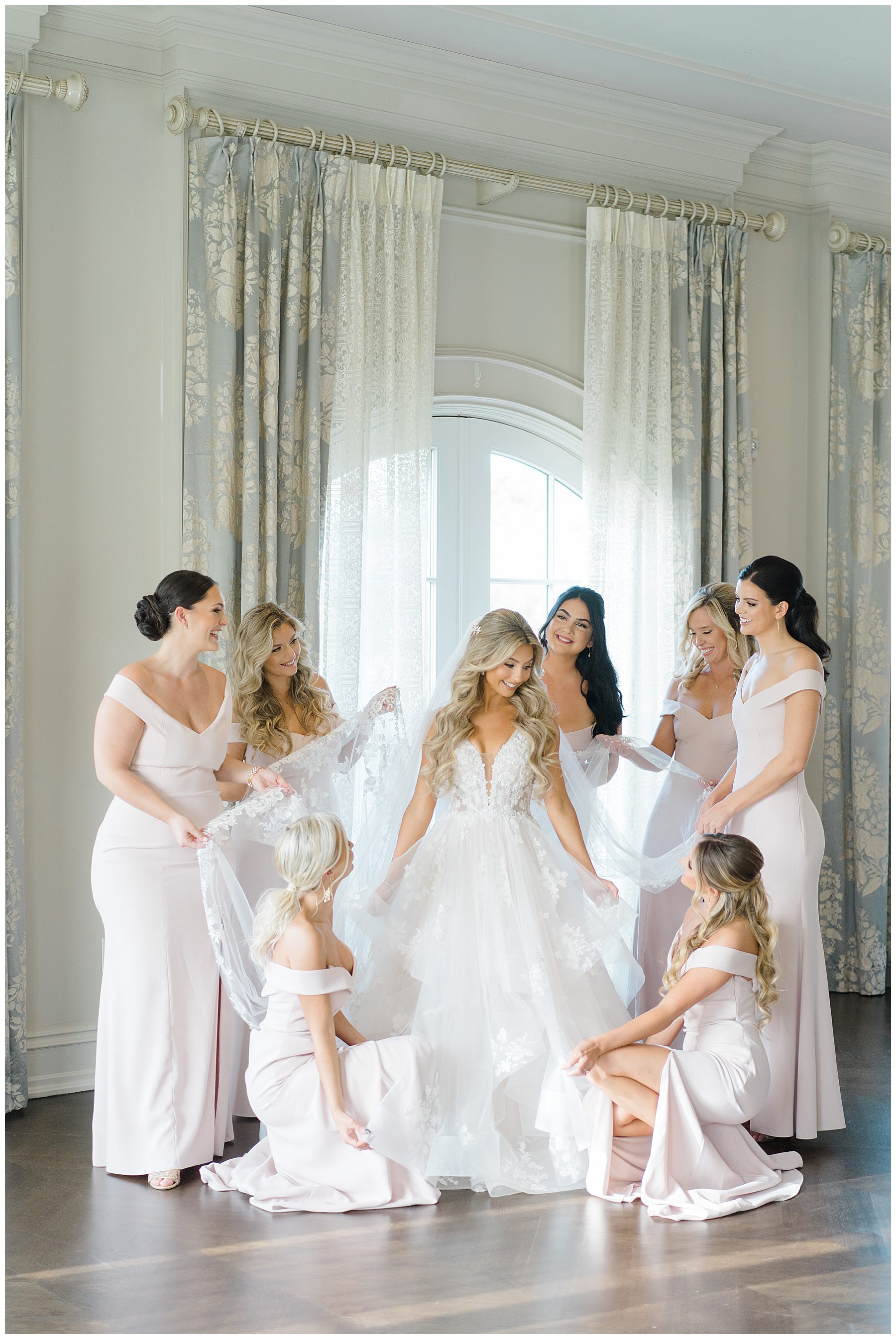 Bridesmaids helping bride to get ready in bridal suite before Park Chateau Fall Wedding