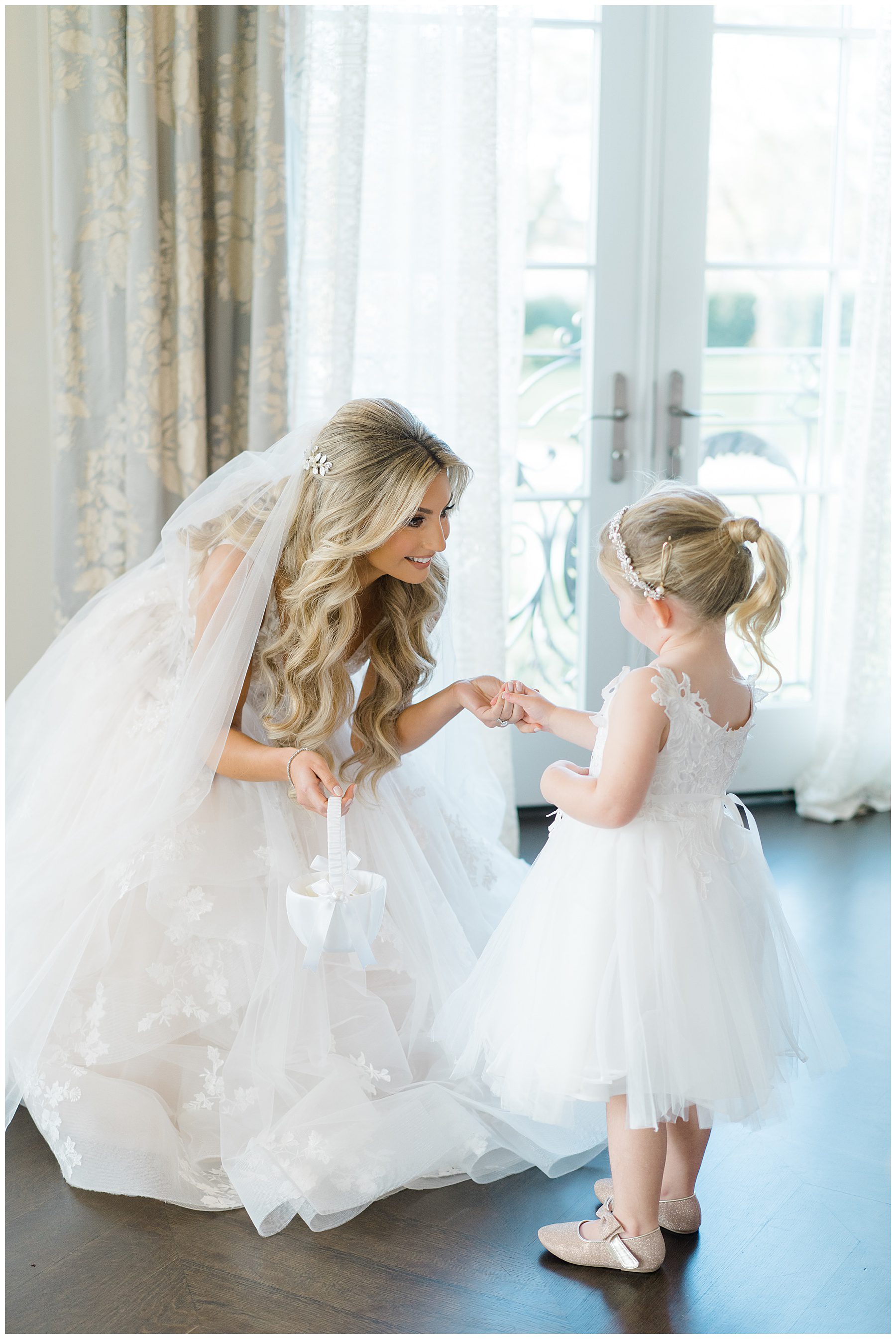 Bride talking with flower girl