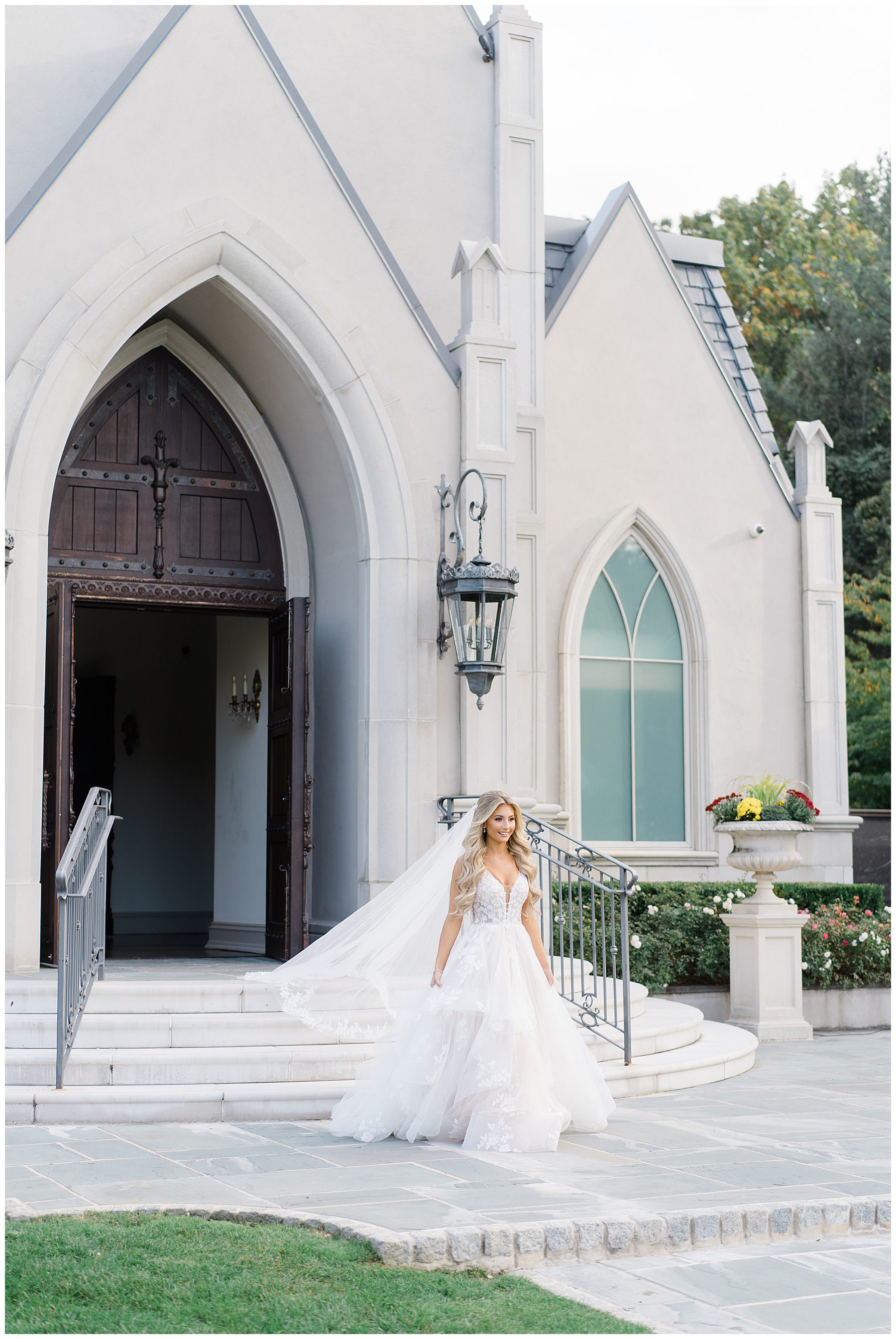 Bride walking down the stairs of chapel