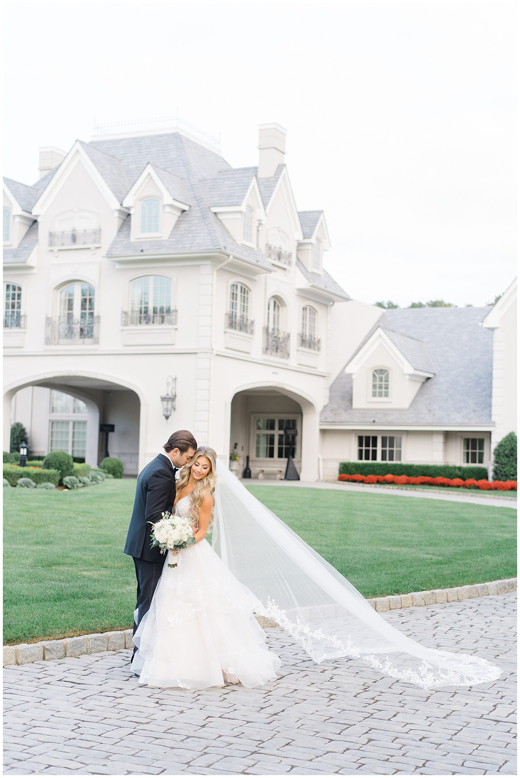 Bride and groom in front of Park Chateau Estate