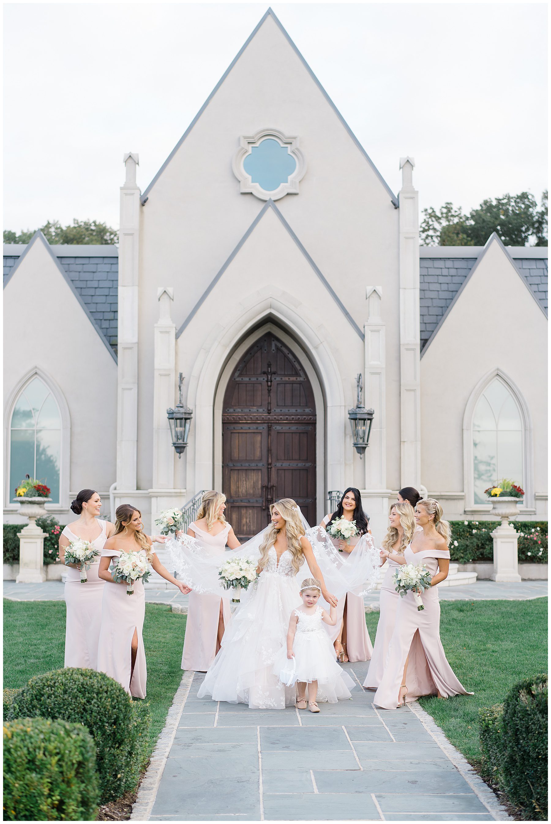 bride and bridesmaids in front of NJ wedding venue Park Chateau