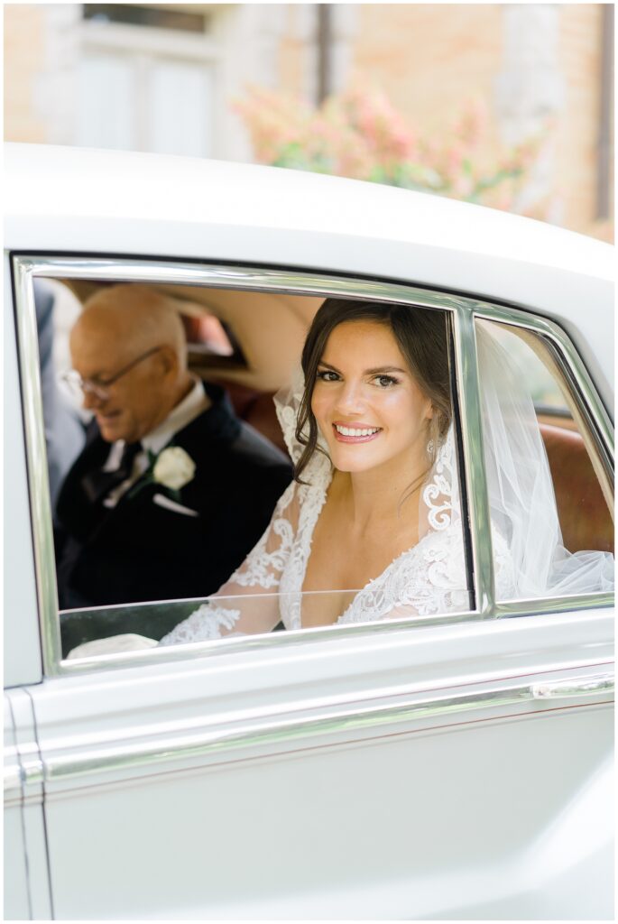 bride in backseat of rolls royce