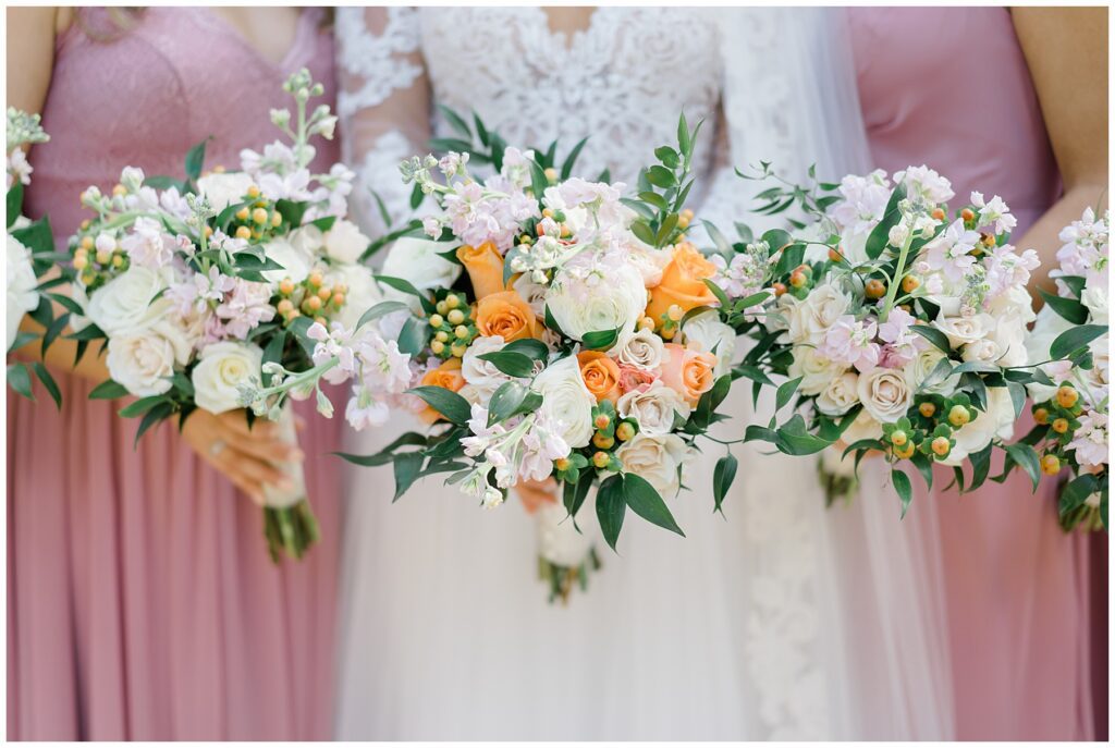 white and coral wedding flower bouquets from Elegant Cairnwood Estate Wedding in Bryn Athyn, PA