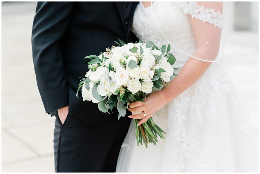 bride holding classic white bouquet
