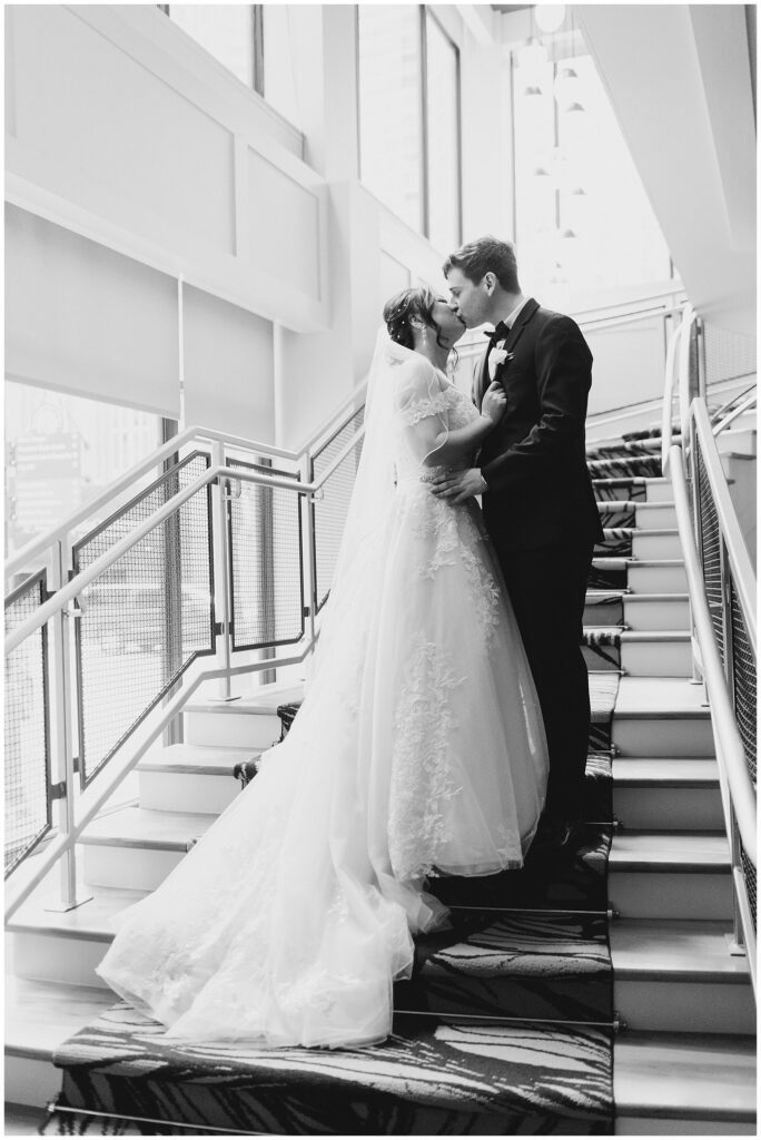 newlyweds kiss on the stairs