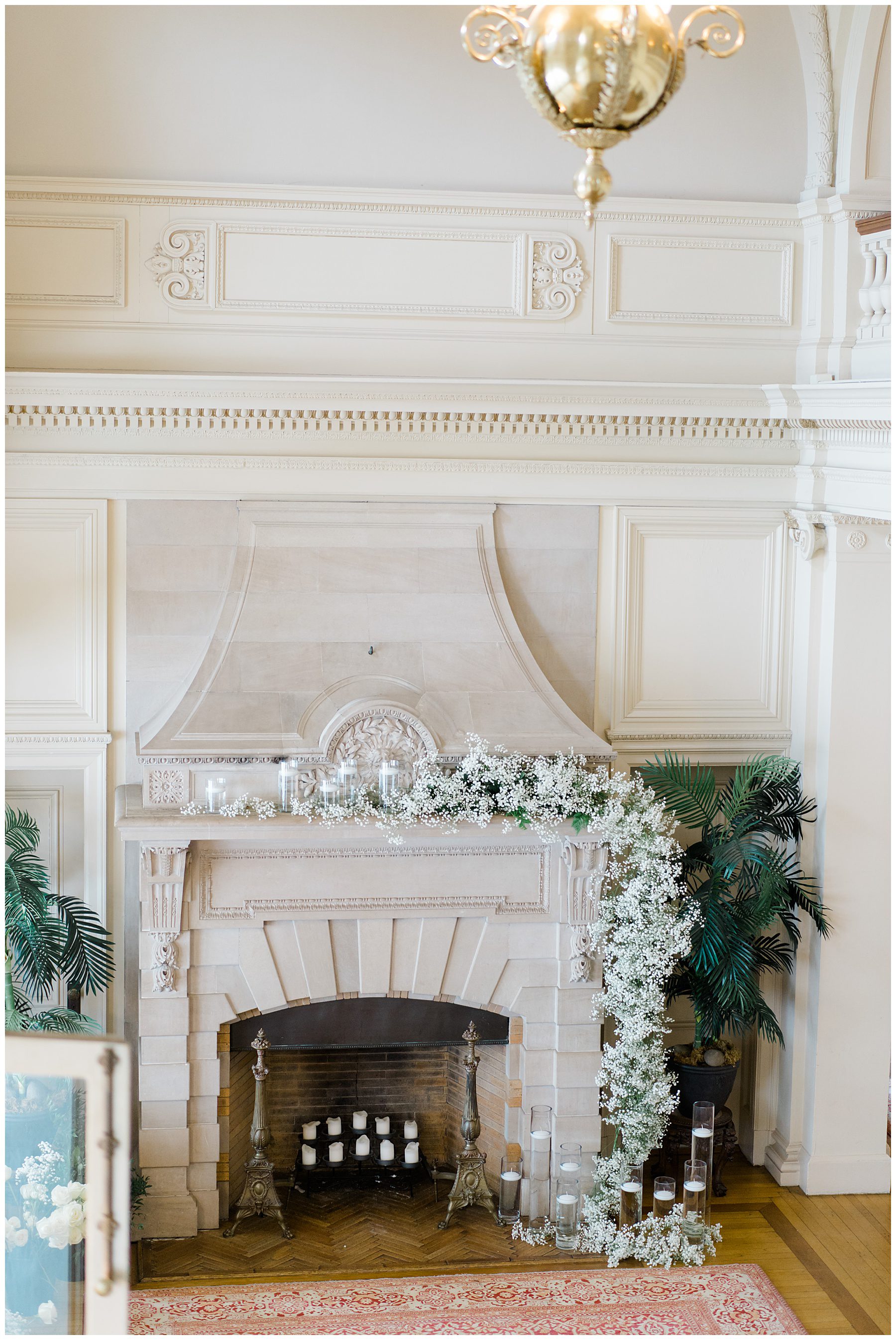 fireplace decorated with flowers for wedding