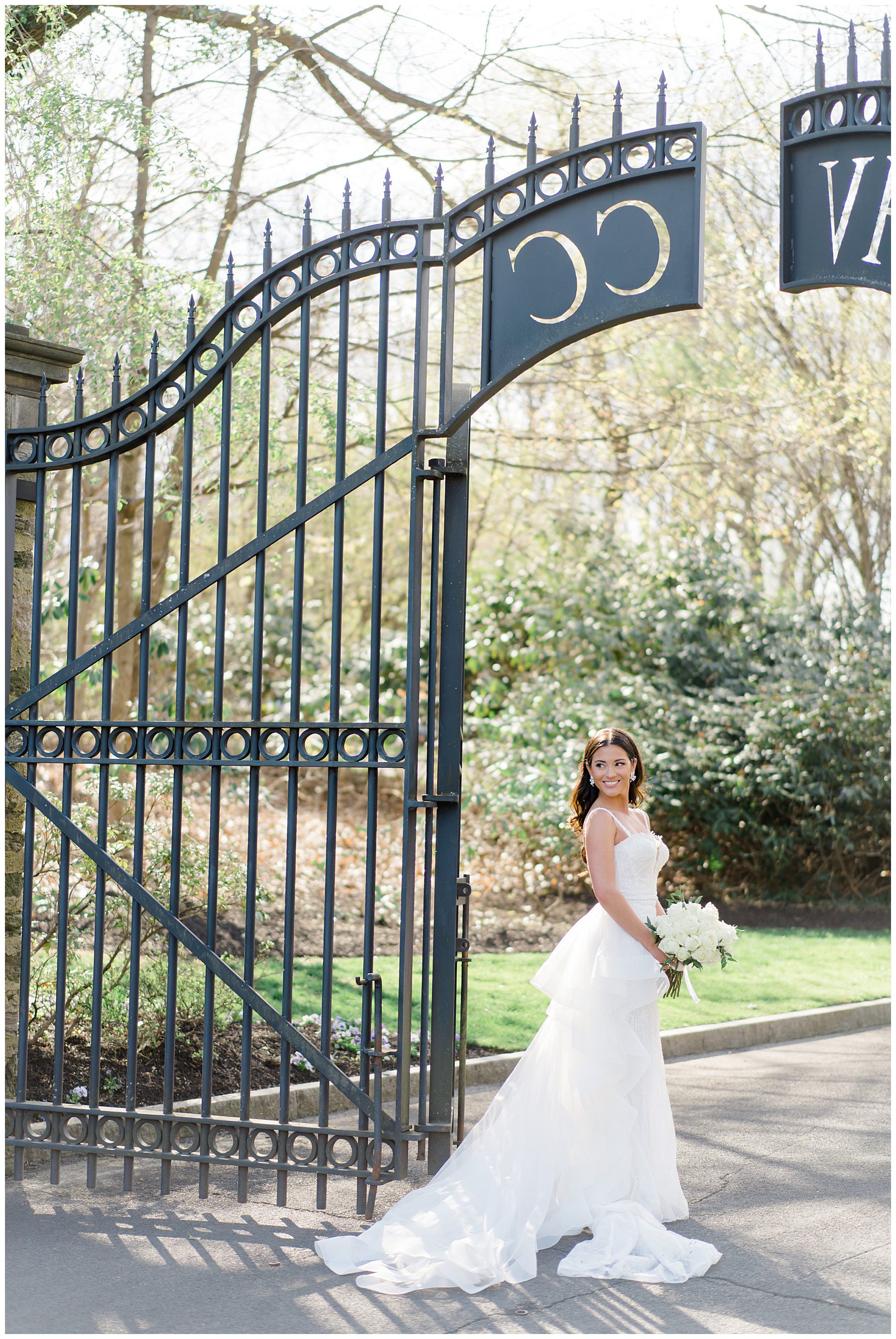bride outside gates of Huntingdon Valley Country Club