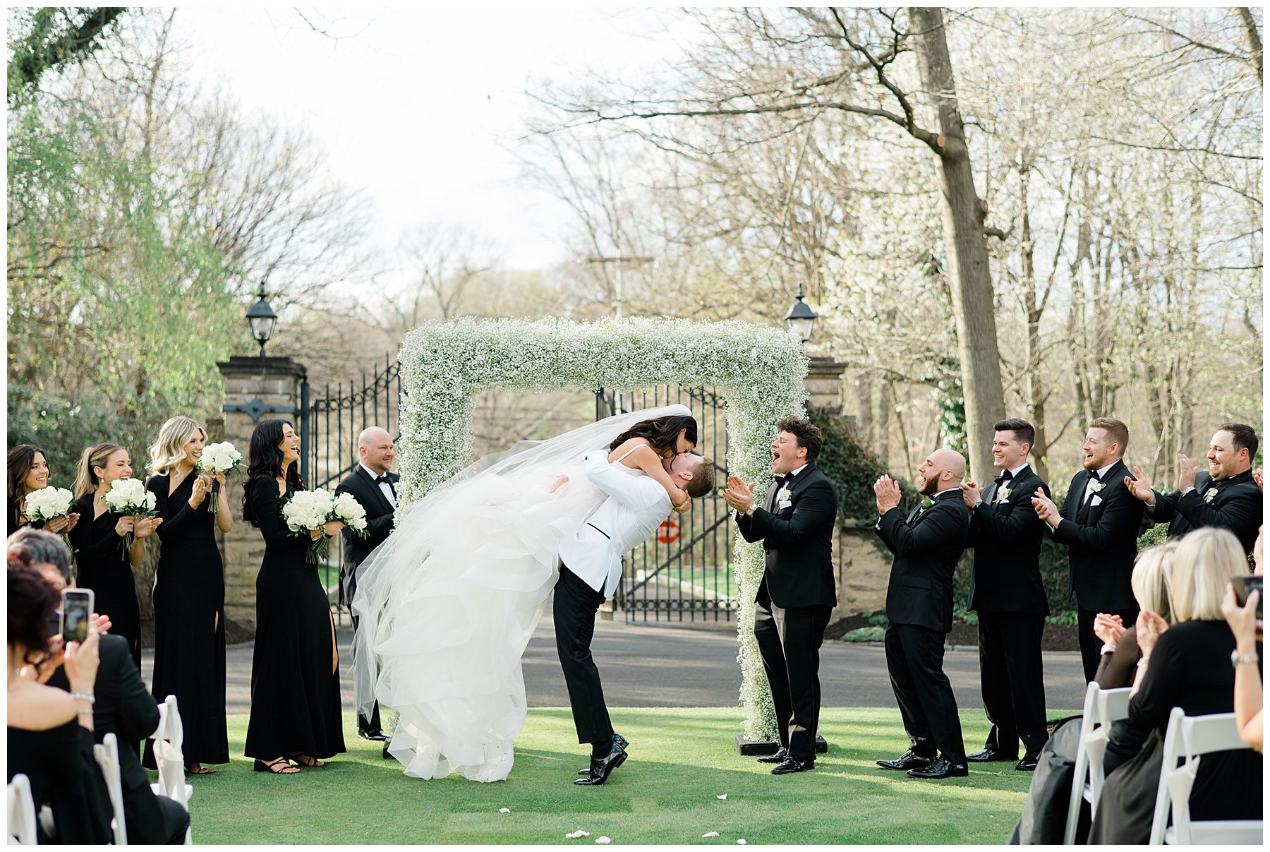 newlyweds kiss during their Cairnwood Estate Wedding in Bryn Athyn, PA