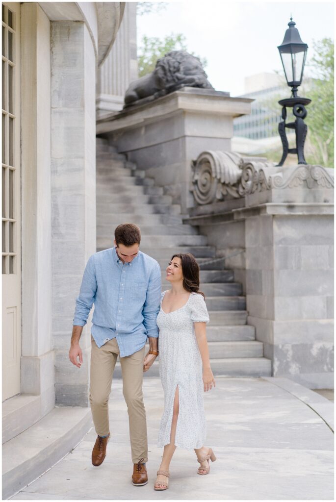 Man and woman walking together along a beautiful building