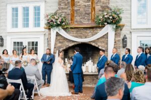 couple at altar of Coach house wedding in NJ