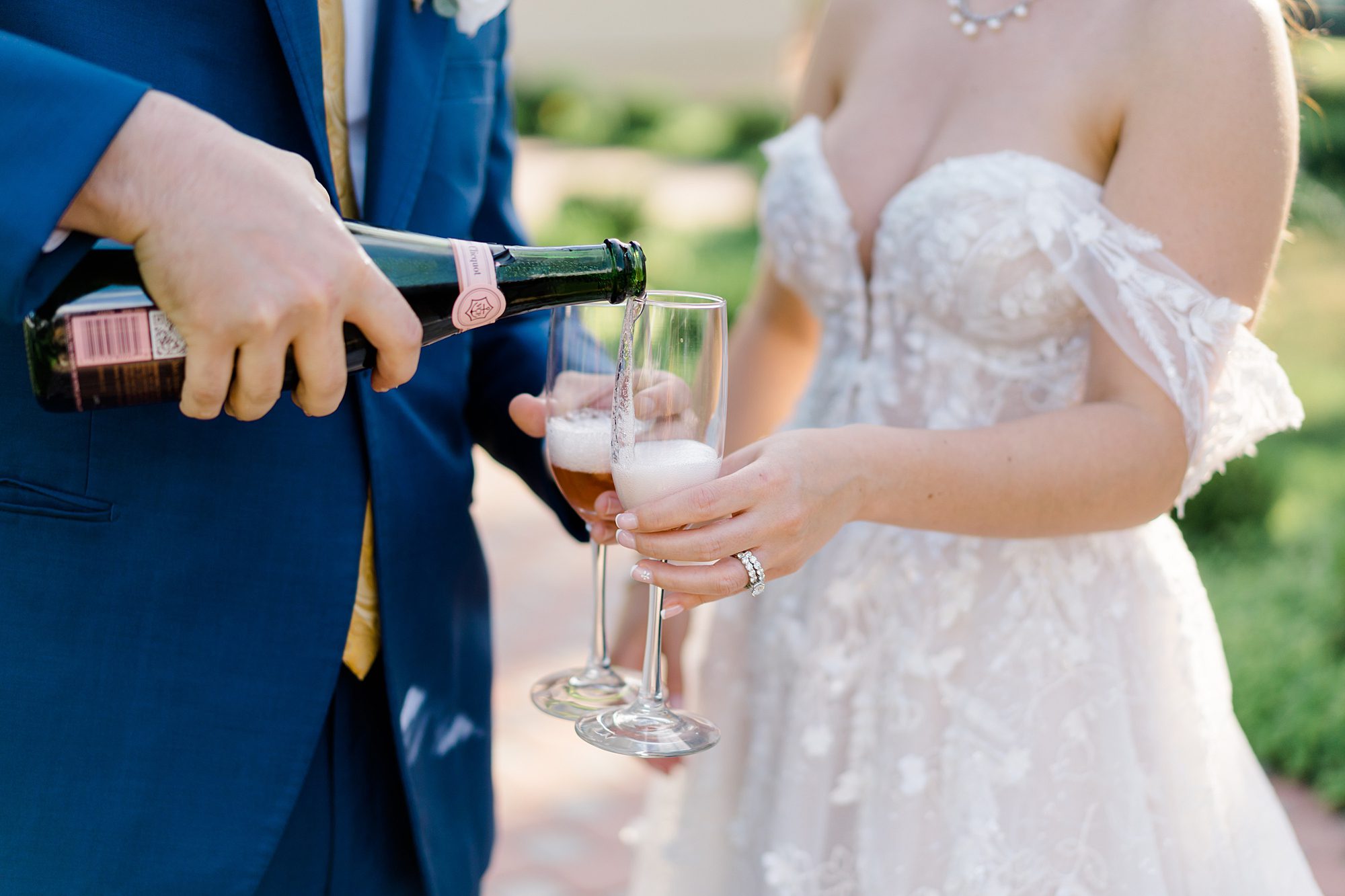newlyweds celebrate marriage with a glass of champagne