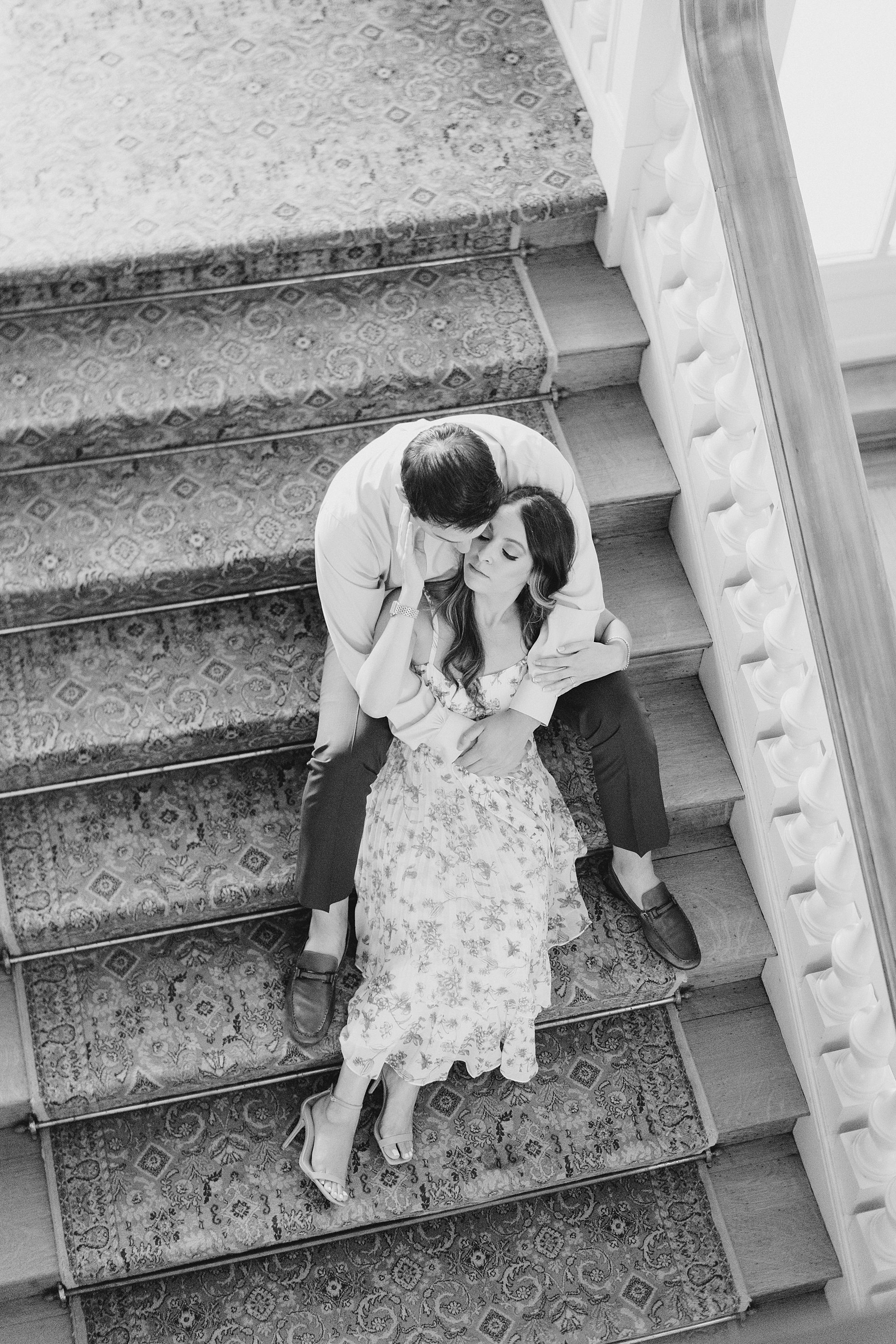 couple on staircase inside the Cairnwood Estate