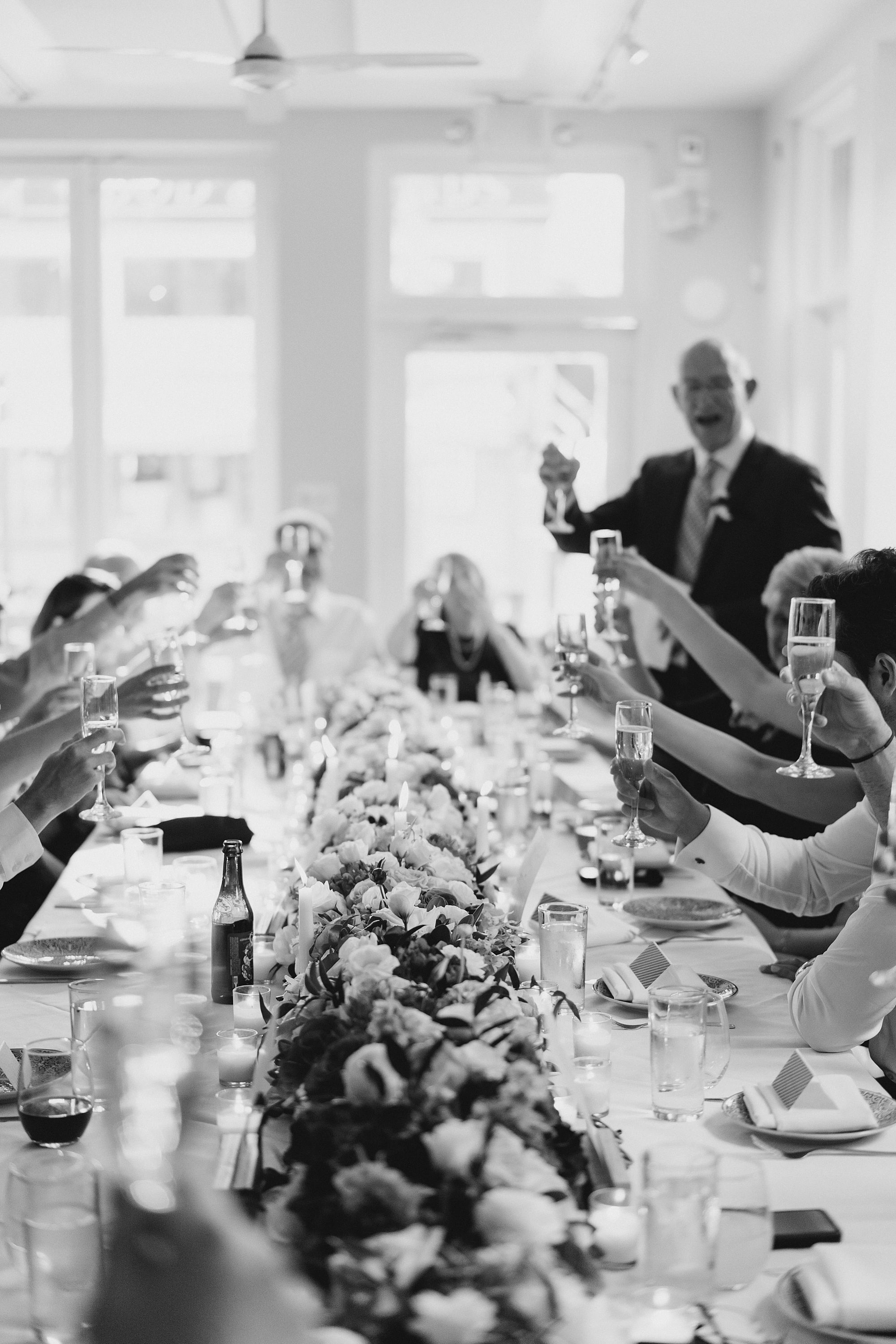 wedding guests toast the newlyweds