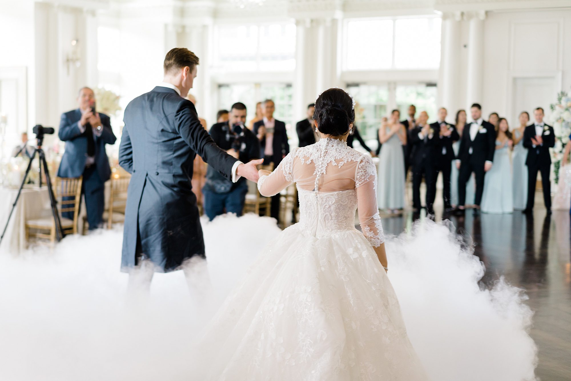 newlyweds dance together at Elegant Park Chateau Wedding reception